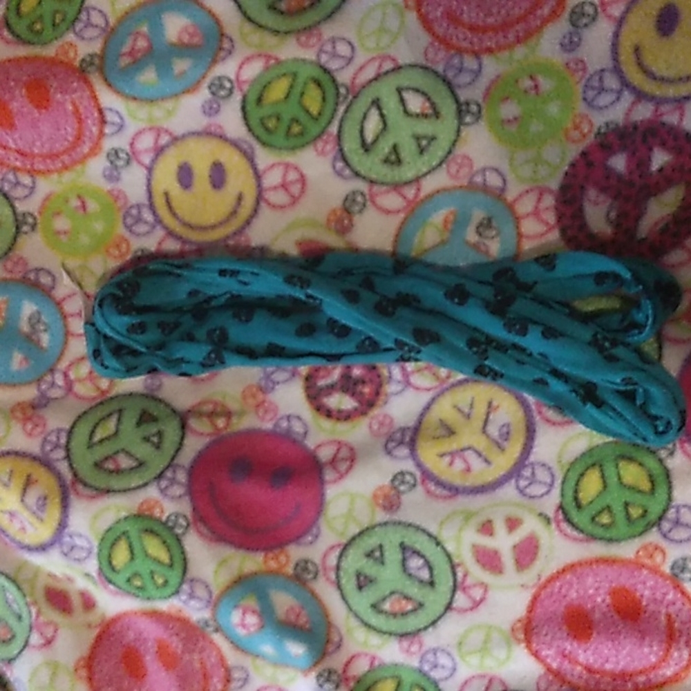 Blue scarf with black skulls